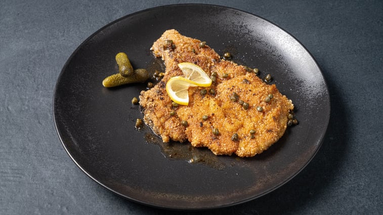 Bone-In Pork Chop Schnitzel with a Lemon and Caper Sauce